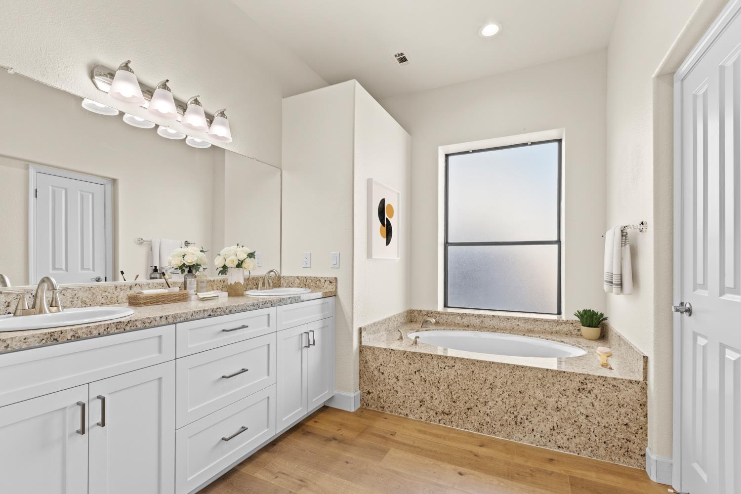 140 Hillside Place Jackson, CA 95642 - Photo 23 of 39 a bathroom with a granite countertop sink a large mirror and a bathtub