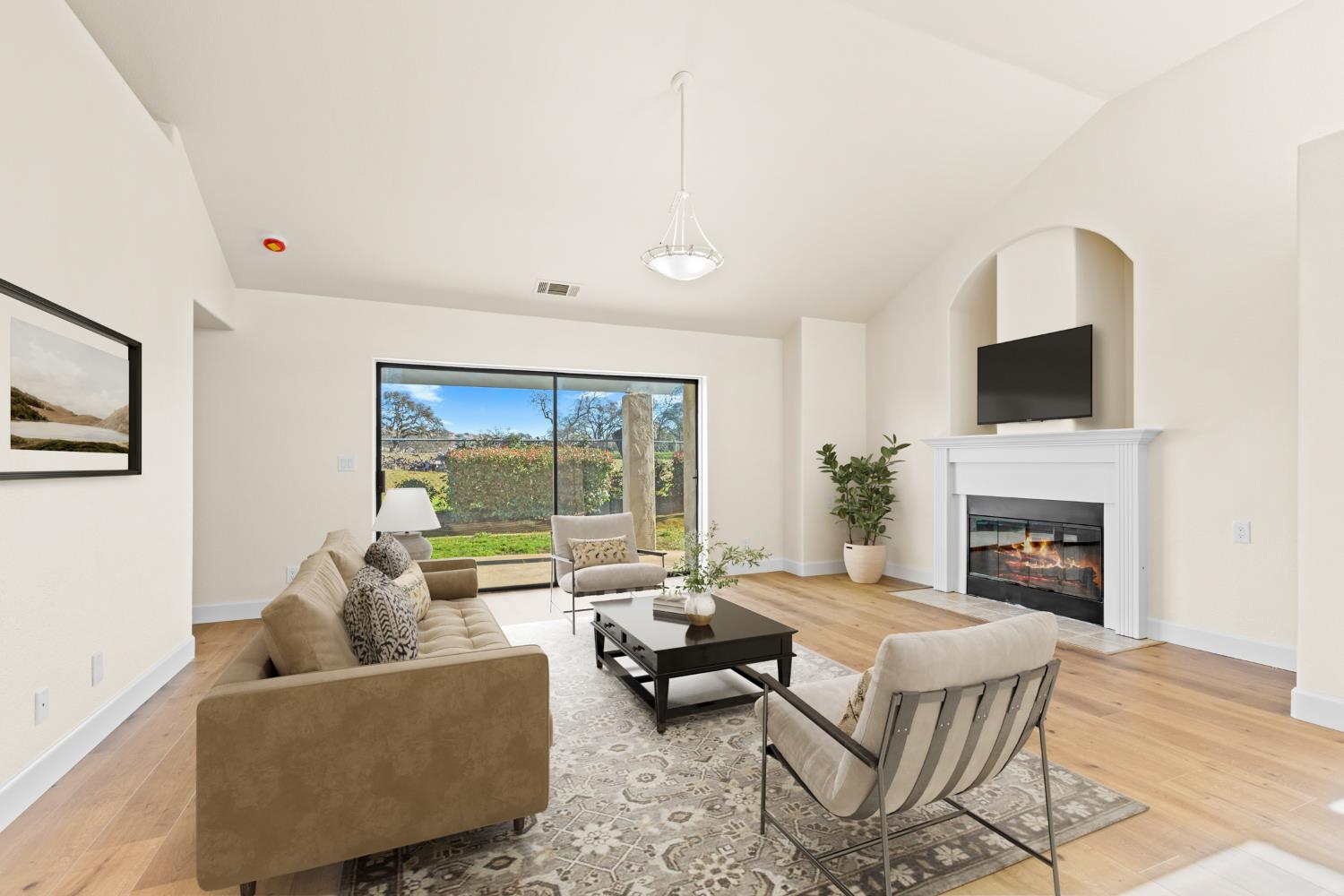 140 Hillside Place Jackson, CA 95642 - Photo 4 of 39 a living room with furniture fireplace and a large window