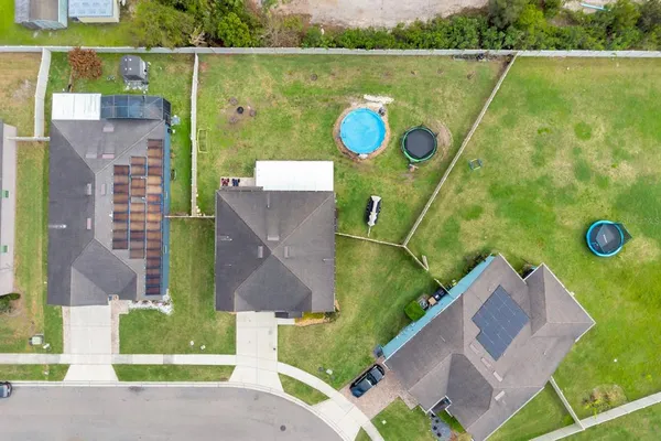 an aerial view of a house with a garden
