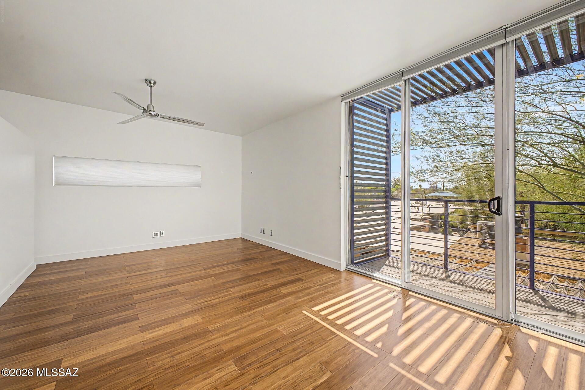 3605 East 3rd Street Tucson, AZ 85716 - Photo 20 of 39 This private primary bedroom is a true sanctuary. Featuring floor to ceiling windows and a covered balcony.