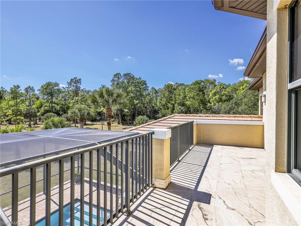 3160 27th Avenue Southwest Naples, FL 34117 - Photo 29 of 43 a view of balcony with wooden floor and fence