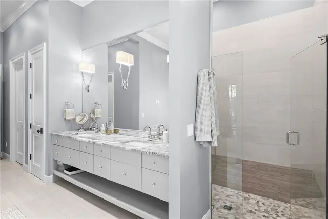 a living room with furniture and floor to ceiling windows