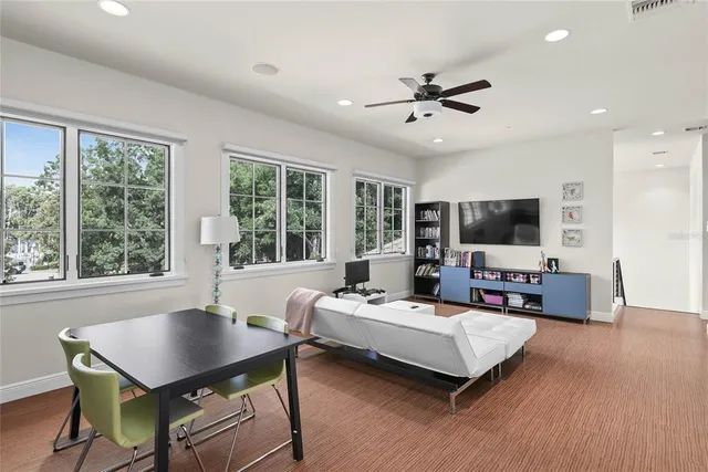 a view of a house with swimming pool and yard