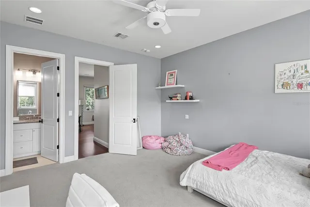 a view of a backyard with sitting area and garden