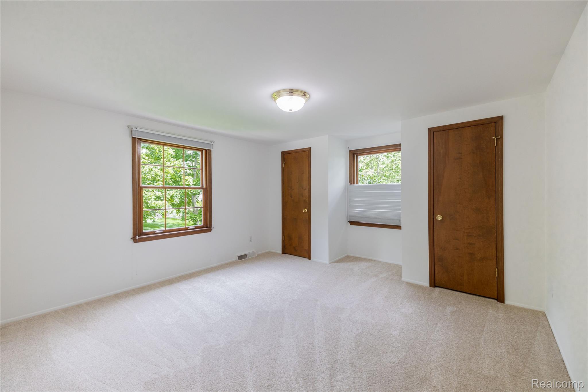 7611 Ferry Road Grosse Ile, MI 48138 - Photo 38 of 51 Carpeted room with a ceiling-mounted light fixture