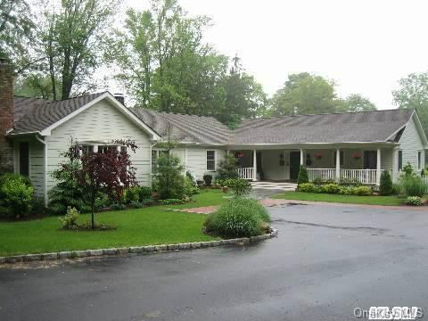 79 Goose Hill Road Cold Spring Harbor, NY 11724 - Photo 1 of 1 a front view of a house with a yard and porch