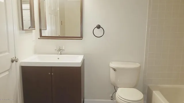 a bathroom with a shower and a toilet