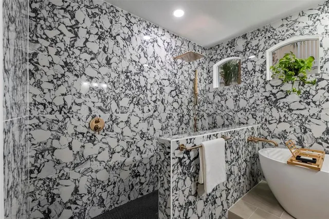 a bathroom with a shower curtain and a sink