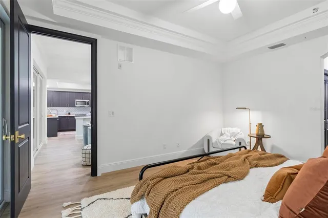 a bedroom with a bed and a view of closet