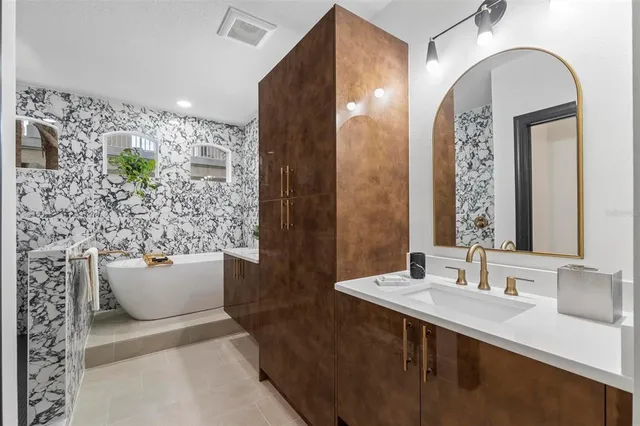 a bathroom with a double vanity sink mirror and shower