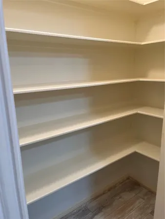 a close view of closet and wooden floor