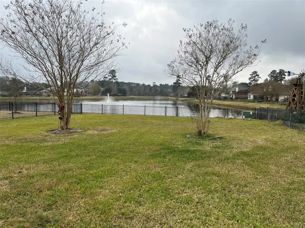 a view of pool with tree s