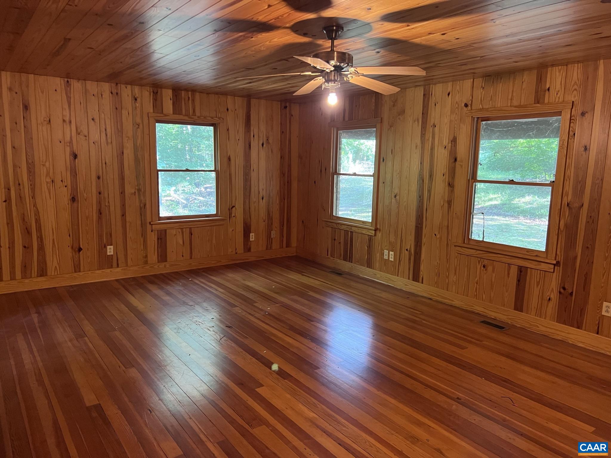 2114 Courthouse Road Palmyra, VA 22963 - Photo 3 of 32 a view of an empty room with wooden floor and a window