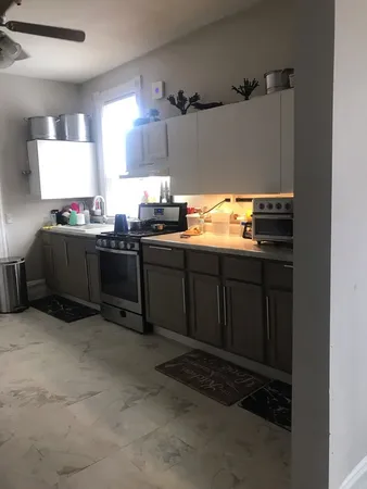 a kitchen with stainless steel appliances granite countertop a sink and cabinets