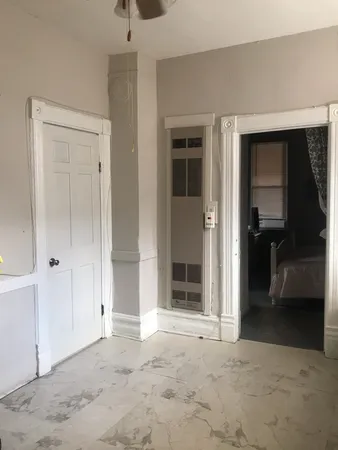 a view of a big room with closet and a bathroom