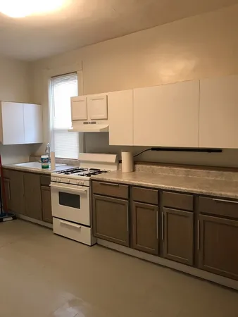 a kitchen that has a sink and a stove