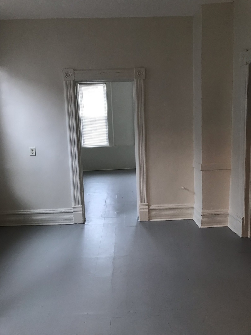 1852 West 17th Street Chicago, IL 60608 - Photo 19 of 19 a view of a small space with wooden floor and a window