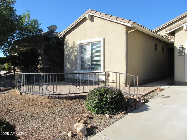 a view of a house with a small yard