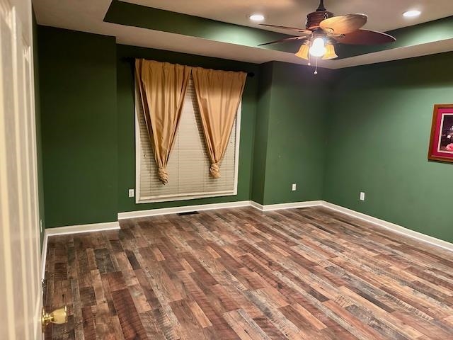 187 Collins Street Ripley, TN 38063 - Photo 21 of 39 a view of an empty room with window chandelier fan and kitchen view