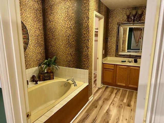187 Collins Street Ripley, TN 38063 - Photo 23 of 39 a bathroom with a tub sink and mirror