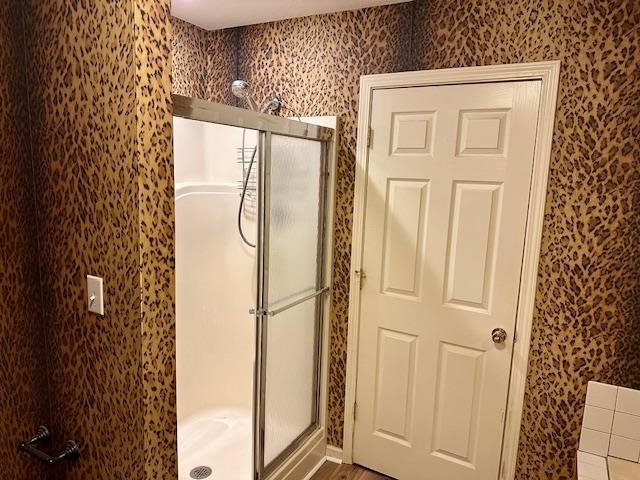 187 Collins Street Ripley, TN 38063 - Photo 28 of 39 a bathroom with a glass shower door and a window