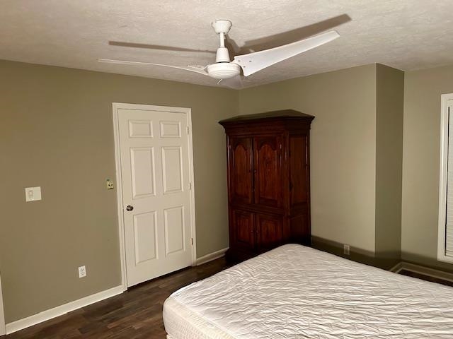 187 Collins Street Ripley, TN 38063 - Photo 31 of 39 a bedroom with a bed and wooden floor