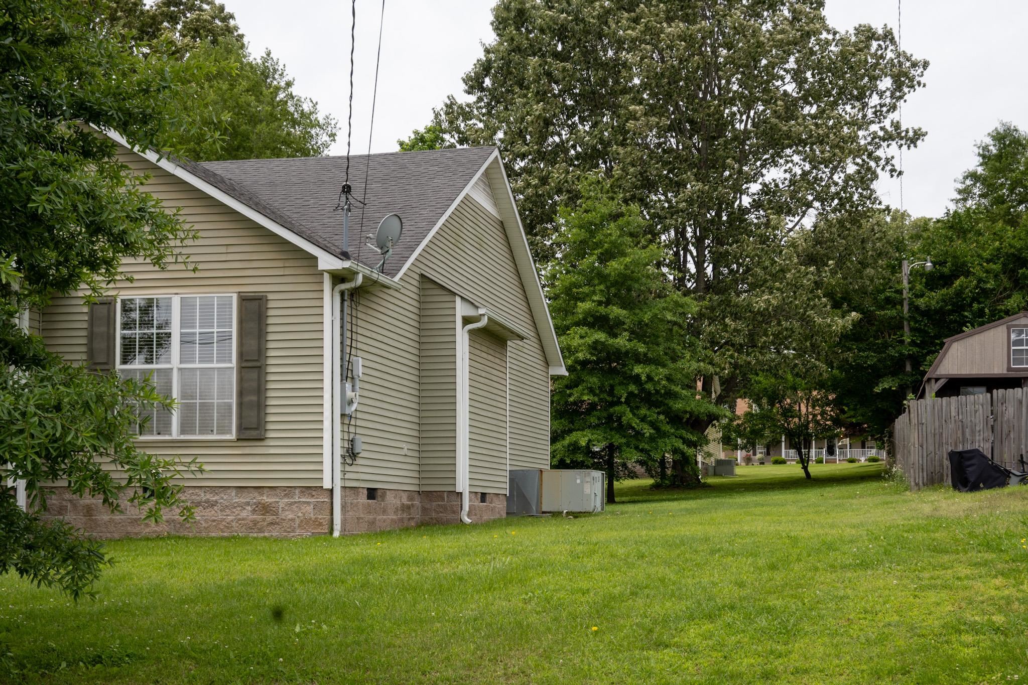 187 Collins Street Ripley, TN 38063 - Photo 37 of 39 a view of a house with a yard