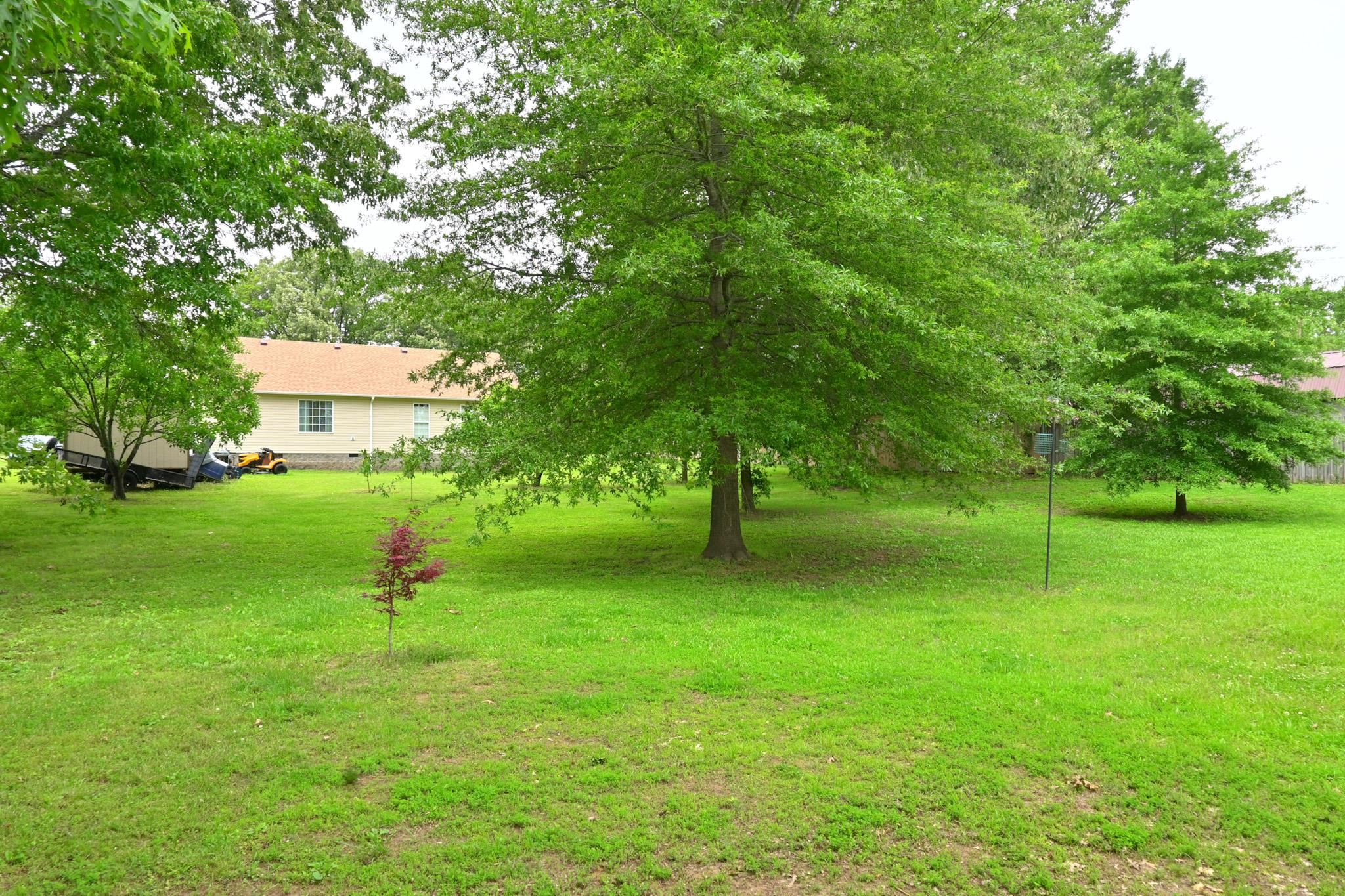 187 Collins Street Ripley, TN 38063 - Photo 39 of 39 a view of a backyard with a garden