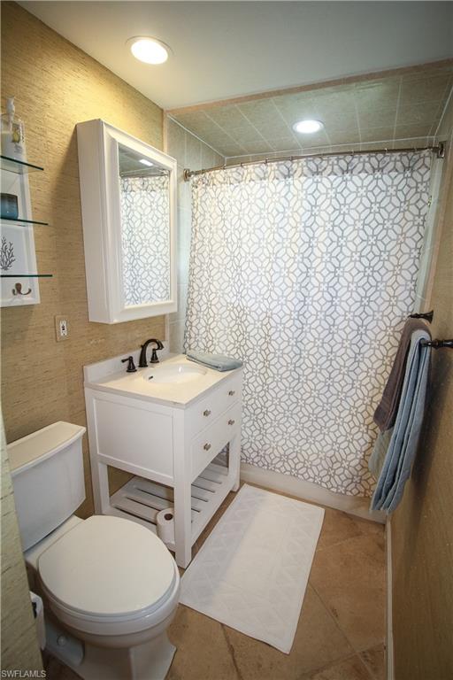 1645 Mullet Court Naples, FL 34102 - Photo 28 of 38 a bathroom with a sink toilet and shower