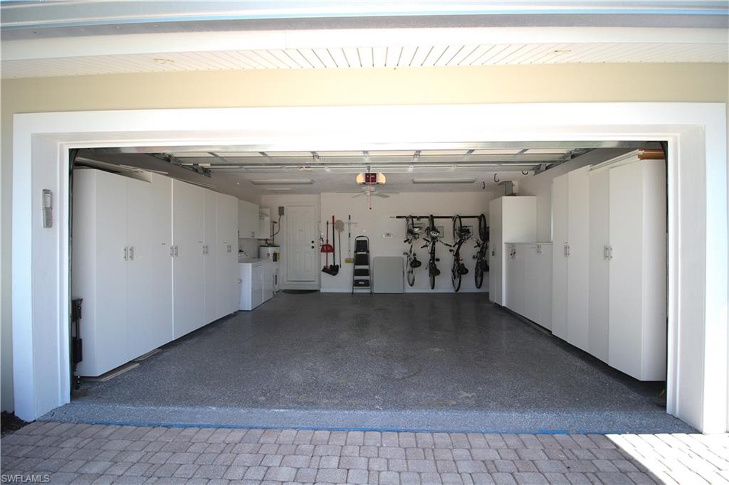 1645 Mullet Court Naples, FL 34102 - Photo 35 of 38 Garage featuring washing machine and dryer