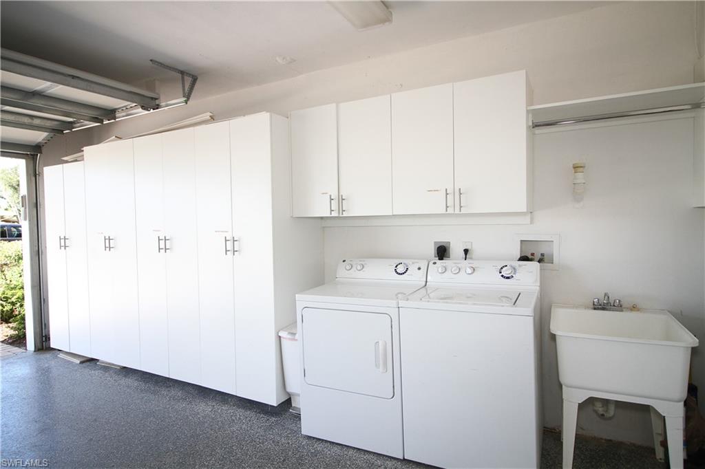 1645 Mullet Court Naples, FL 34102 - Photo 36 of 38 a view of storage and utility room with washer and dryer