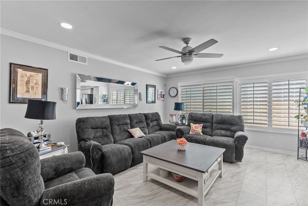 25536 Old Course Way Valencia, CA 91355 - Photo 17 of 37 a living room with furniture ceiling fan and a window