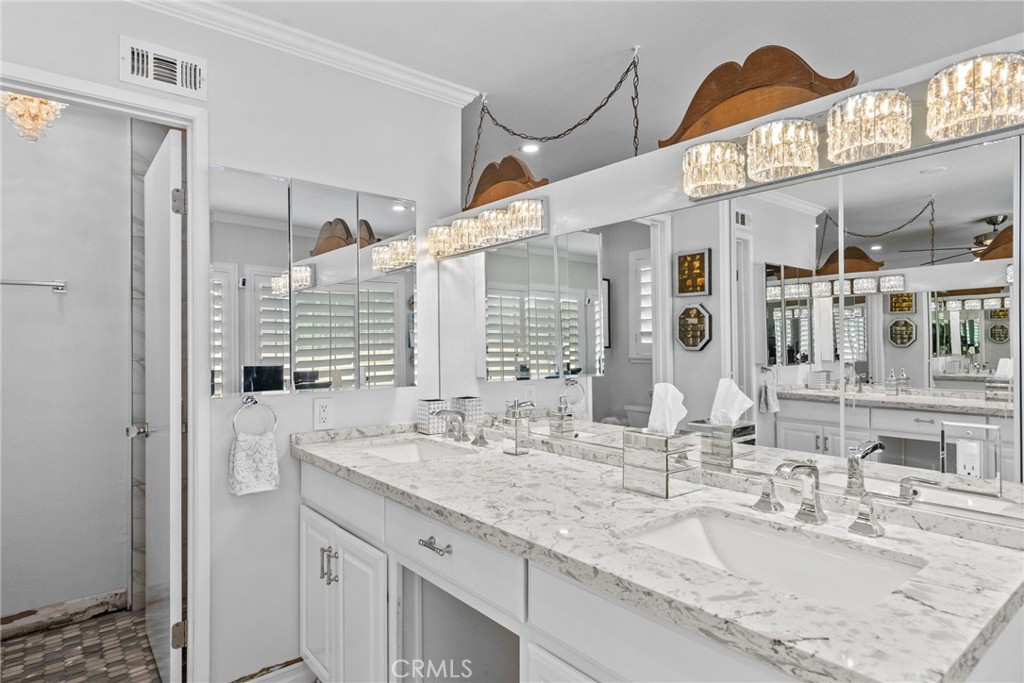 25536 Old Course Way Valencia, CA 91355 - Photo 25 of 37 a bathroom with a granite countertop sink and a mirror