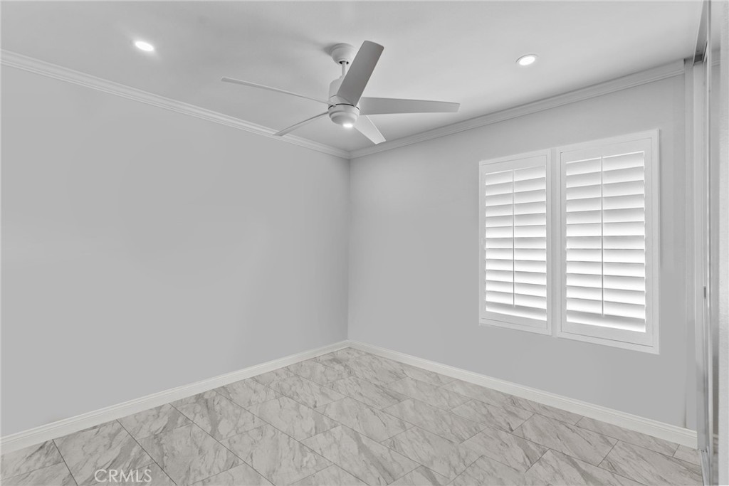 25536 Old Course Way Valencia, CA 91355 - Photo 28 of 37 an empty room with windows and fan