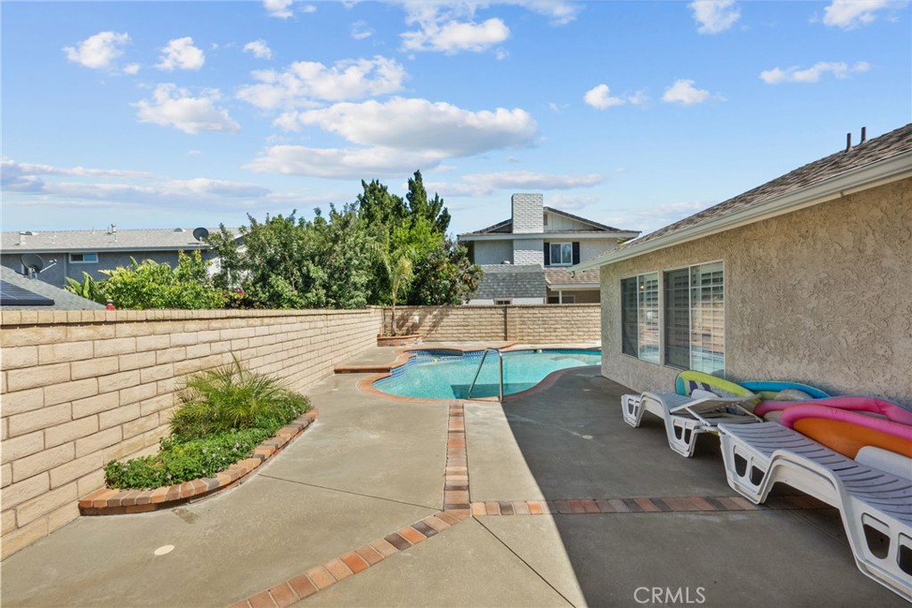 25536 Old Course Way Valencia, CA 91355 - Photo 34 of 37 a backyard of a house with table and chairs