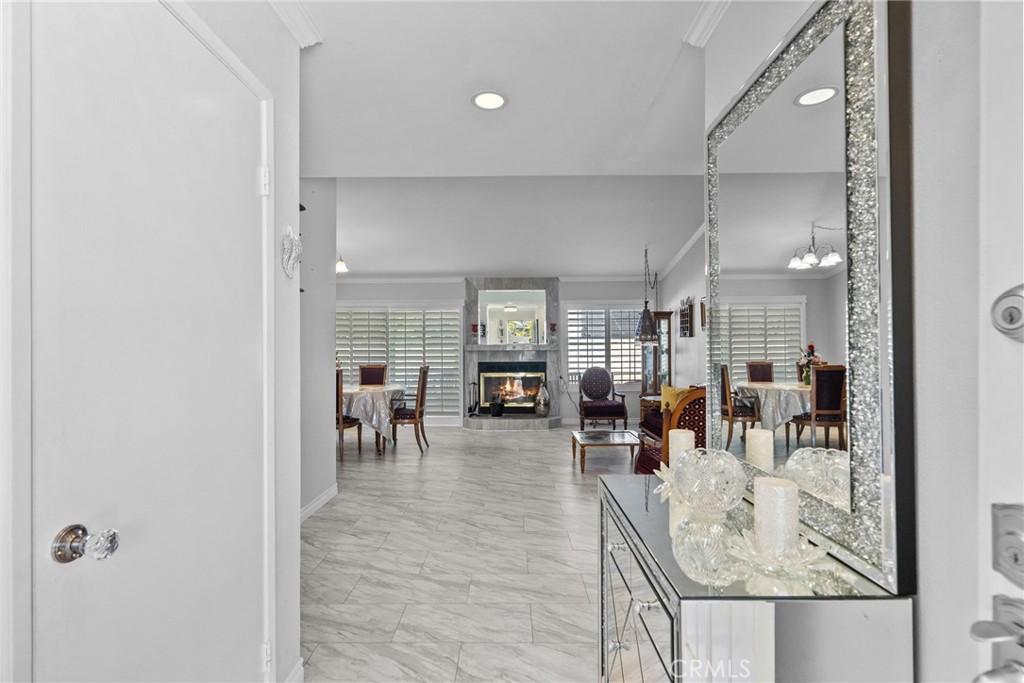 25536 Old Course Way Valencia, CA 91355 - Photo 5 of 37 a living room with lots of furniture and chandelier