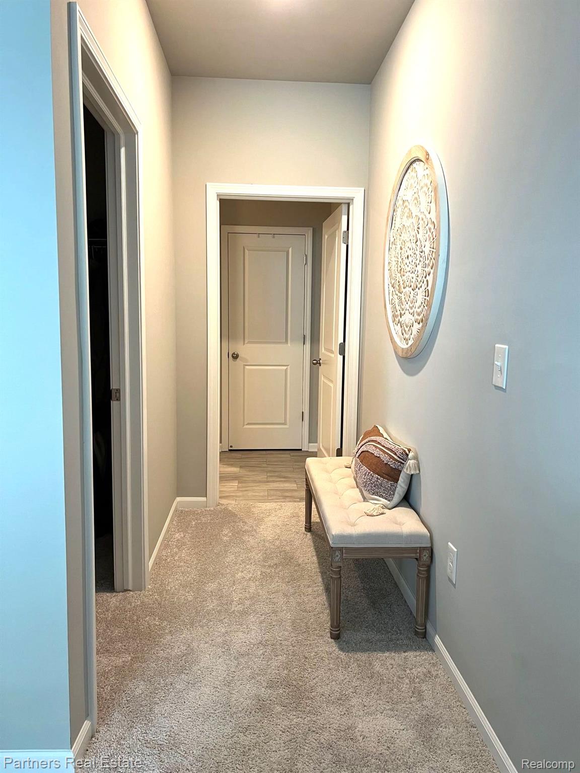 9788 Ridge Run Street, Unit 65 Howell, MI 48855 - Photo 16 of 28 HALLWAY LEADING TO WALK IN CLOSET & MASTER BATH
