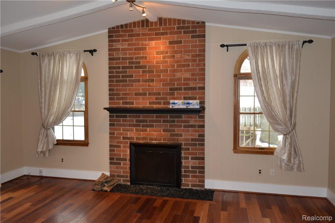 971 Brighton Lake Road Brighton, MI 48116 - Photo 5 of 21 family room w/ natural fireplace