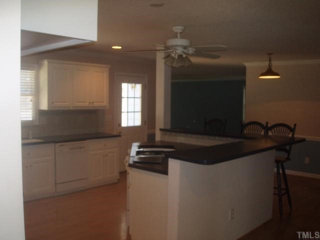 5104 Hallmark Road Durham, NC 27712 - Photo 7 of 12 a kitchen with a sink and cabinets