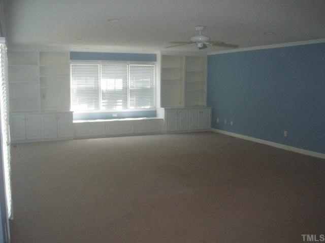5104 Hallmark Road Durham, NC 27712 - Photo 9 of 12 an empty room with a empty space and windows
