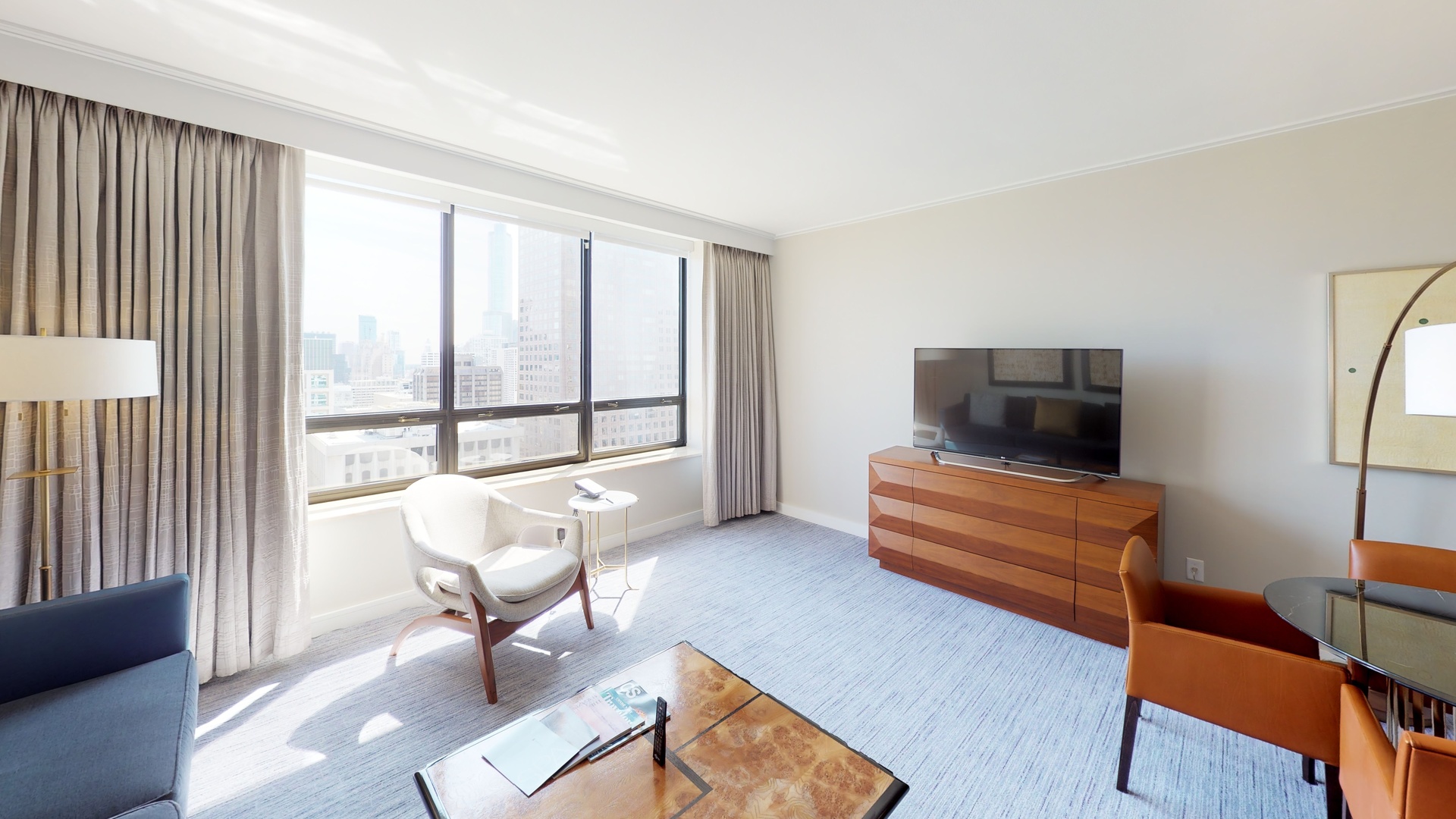 160 East Pearson Street, Unit 3104 Chicago, IL 60611 - Photo 4 of 12 a living room with furniture and a flat screen tv