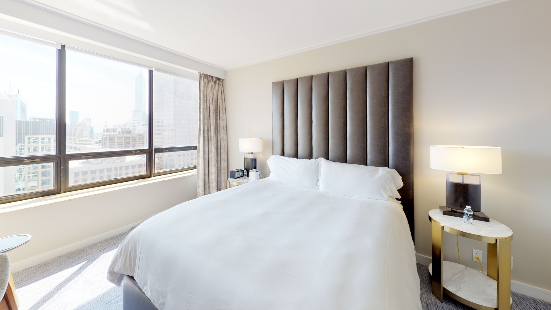 160 East Pearson Street, Unit 3104 Chicago, IL 60611 - Photo 6 of 12 a spacious bedroom with a bed and a window