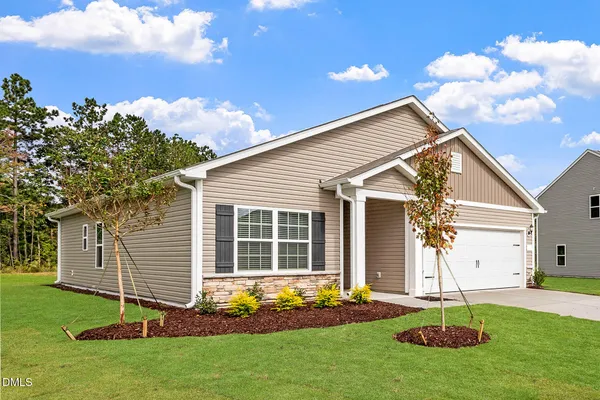 a view of a house with backyard and porch