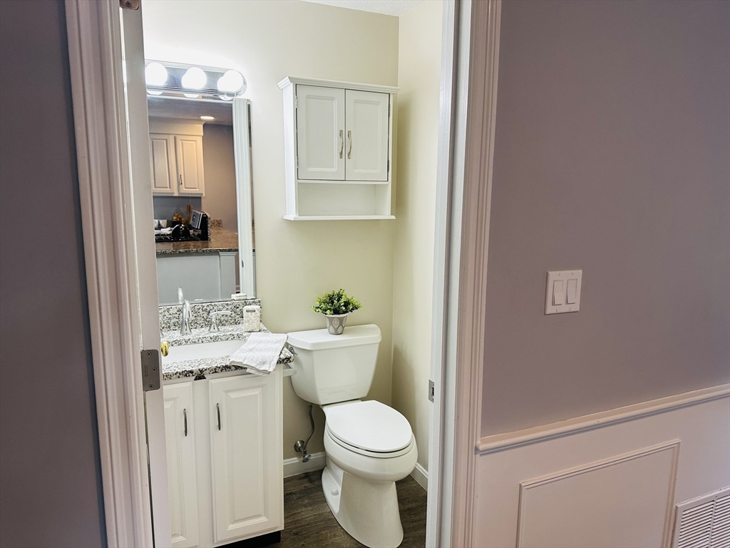 9 Averill Road, Unit B Middleton, MA 01949 - Photo 5 of 18 a white toilet sitting next to a bathroom sink