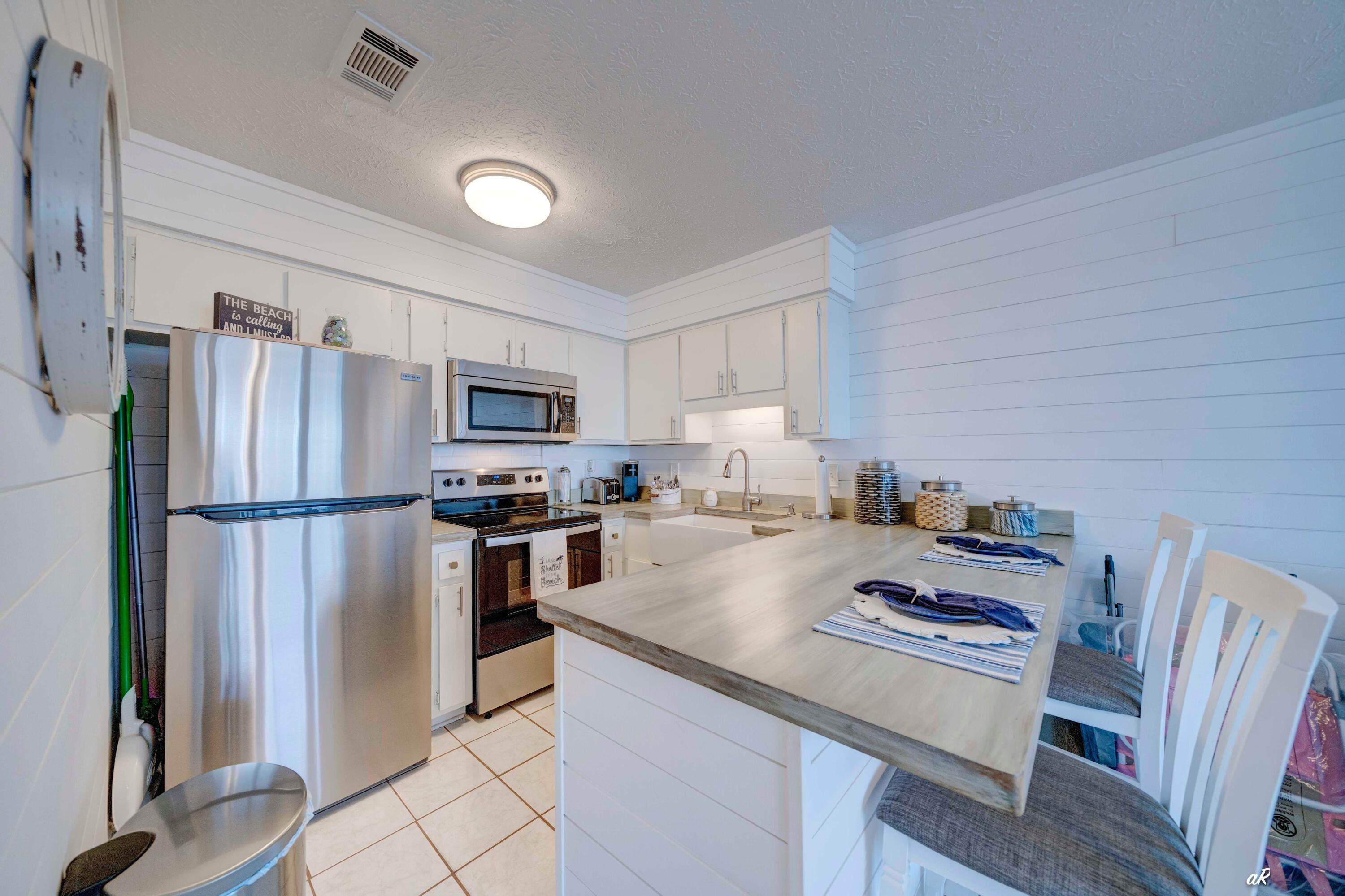 17670 Front Beach Road, Unit D1 Panama City Beach, FL 32413 - Photo 10 of 22 Kitchen with Stainless Steel Appliances