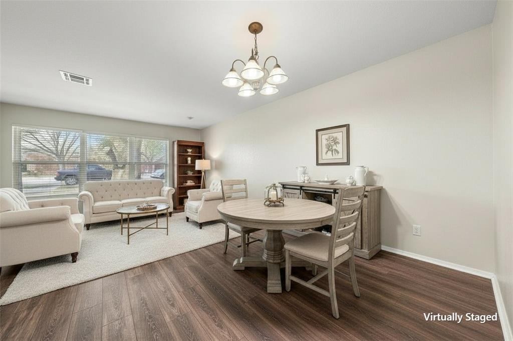 5907 Caldwell Street Waco, TX 76710 - Photo 11 of 22 a view of a dining room with furniture wooden floor and chandelier