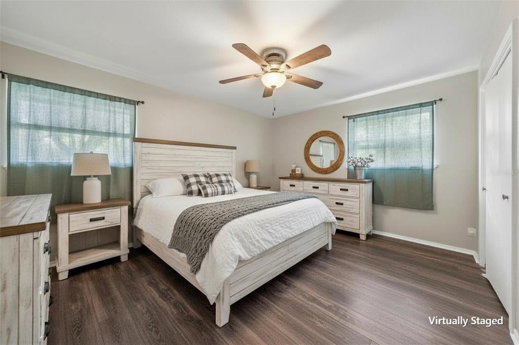 5907 Caldwell Street Waco, TX 76710 - Photo 13 of 22 a bedroom with a bed and a chandelier