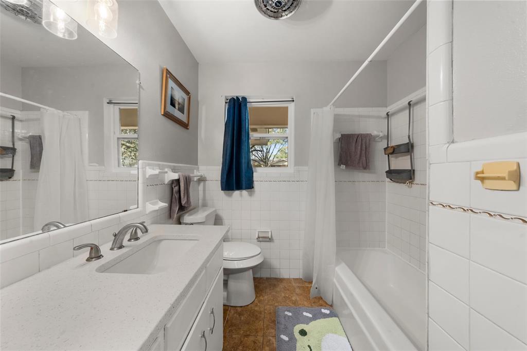 5907 Caldwell Street Waco, TX 76710 - Photo 16 of 22 a bathroom with a sink toilet and shower