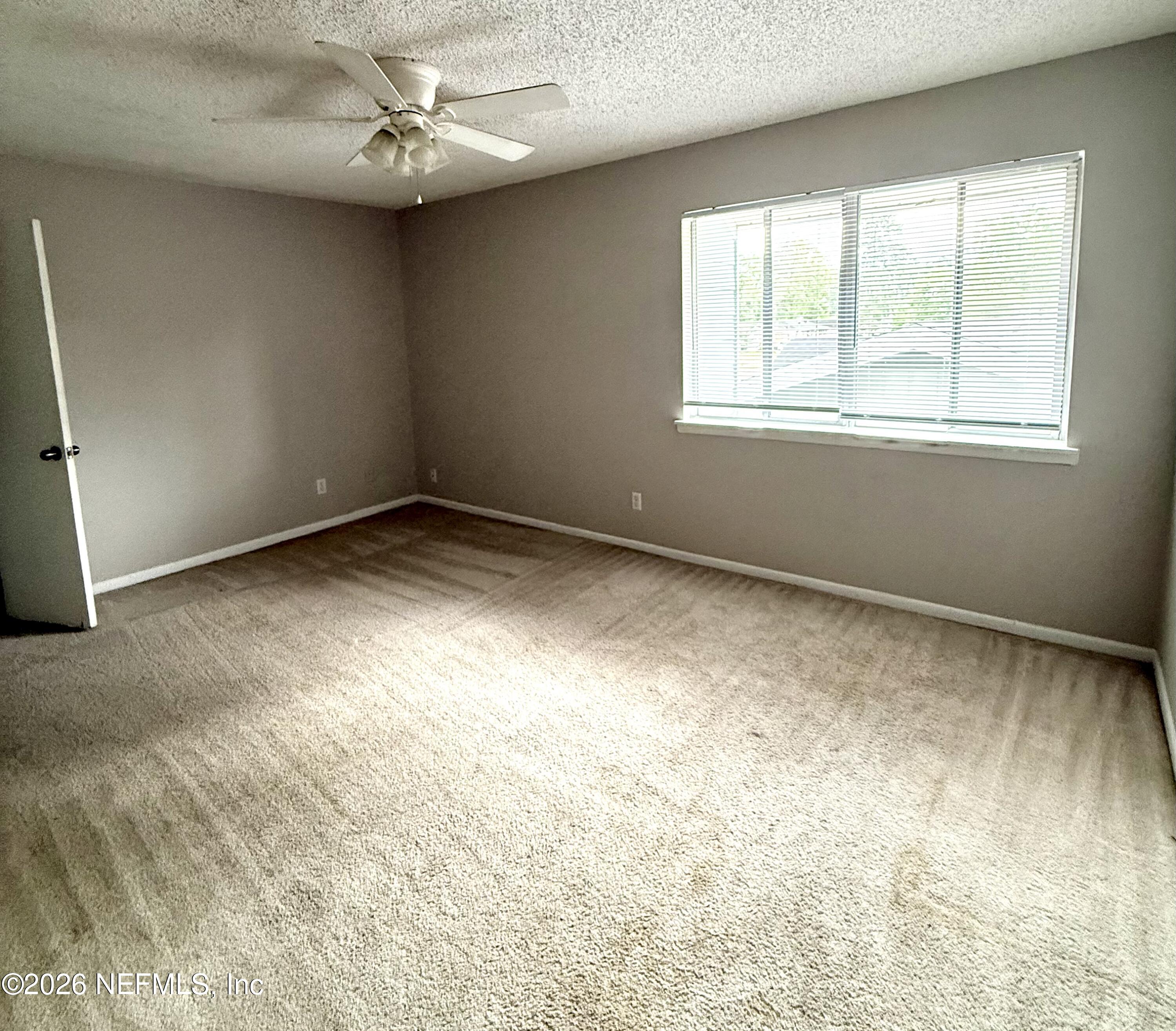 11598 West Ride Drive Jacksonville, FL 32223 - Photo 12 of 15 an empty room with a window