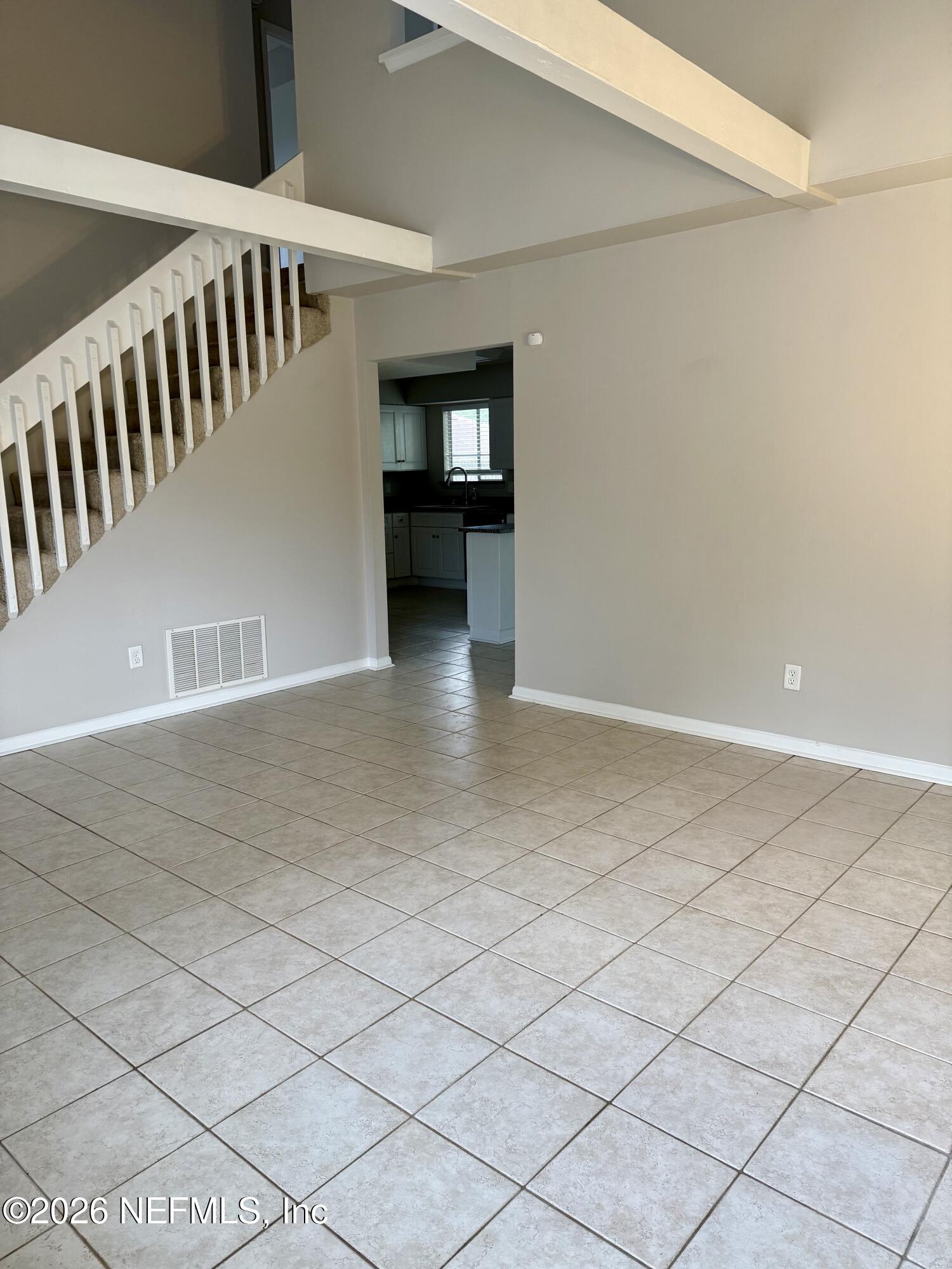 11598 West Ride Drive Jacksonville, FL 32223 - Photo 3 of 15 a view of an empty room with wooden floor